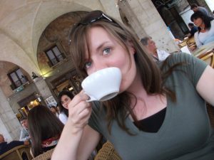 woman drinking coffee in Italian bar