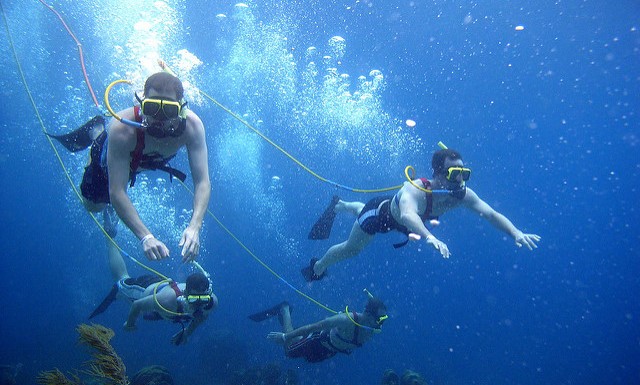 four SNUBA divers in ocean