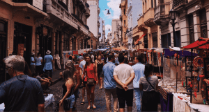 Person walking through stalls on a language holiday in Spain