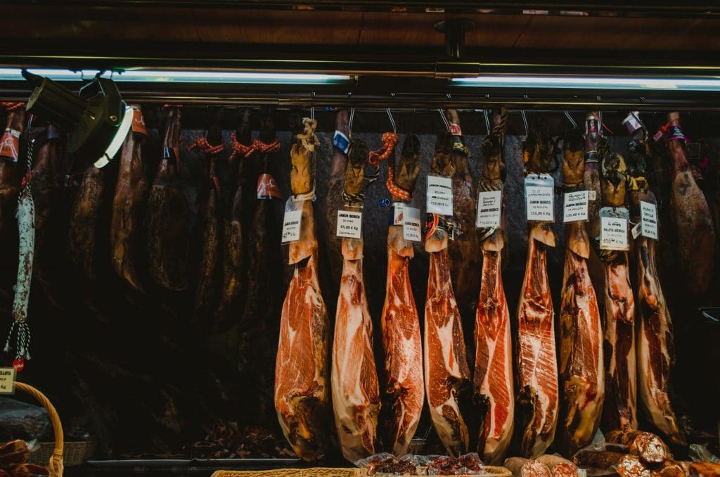 legs of ham in a market