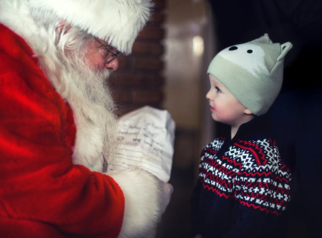 child visiting Santa