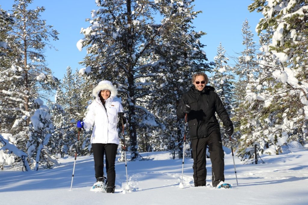 couple snowshoeing in lapland