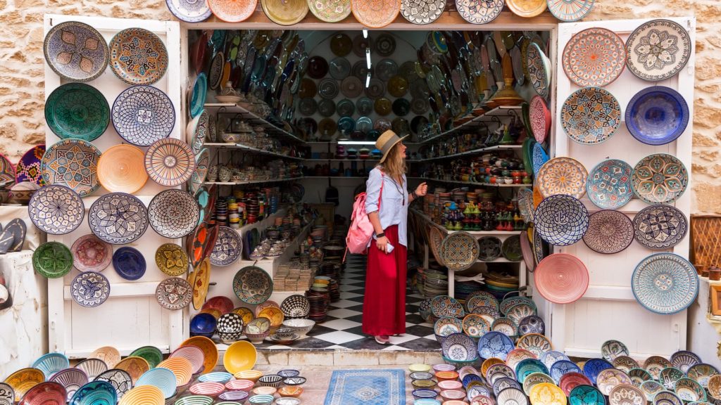 female tourist shopping in Moroccan souvenir shop