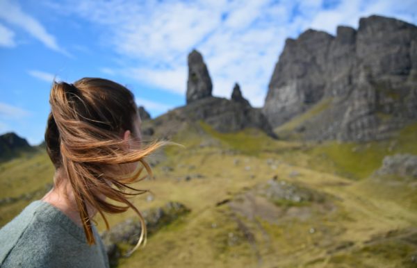 woman looks at mountains in isle of skye