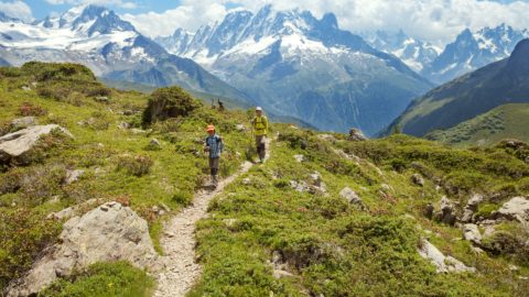 hikers walking through alps in france