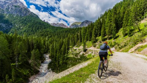 man cycling through italian landscape