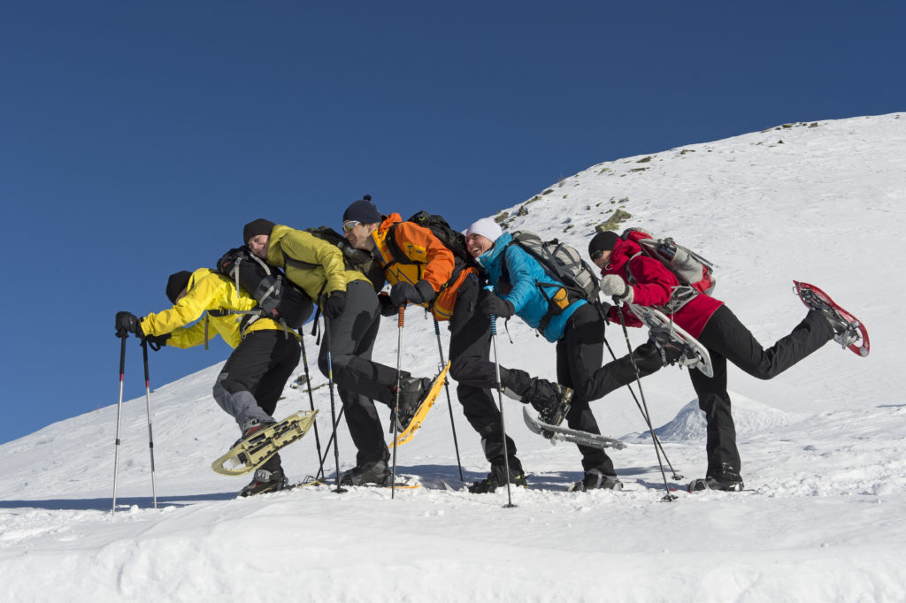 group of people snowshoeing in the french pyrenees