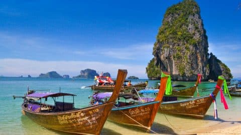 boats on a beach in southern thailand