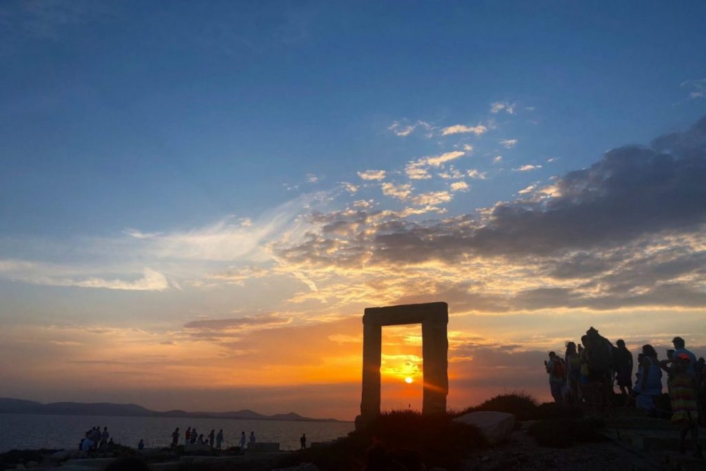 sunset at a monument in paros greece