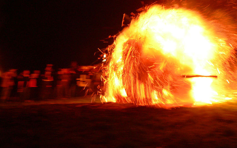 burning wheel of hay