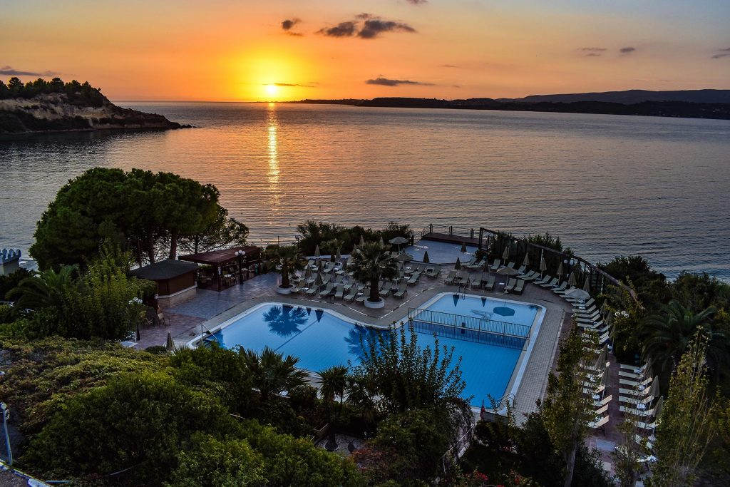 hotel swimming pool at sunset