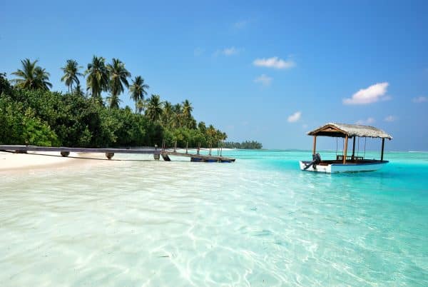 beach and a boat in the maldives