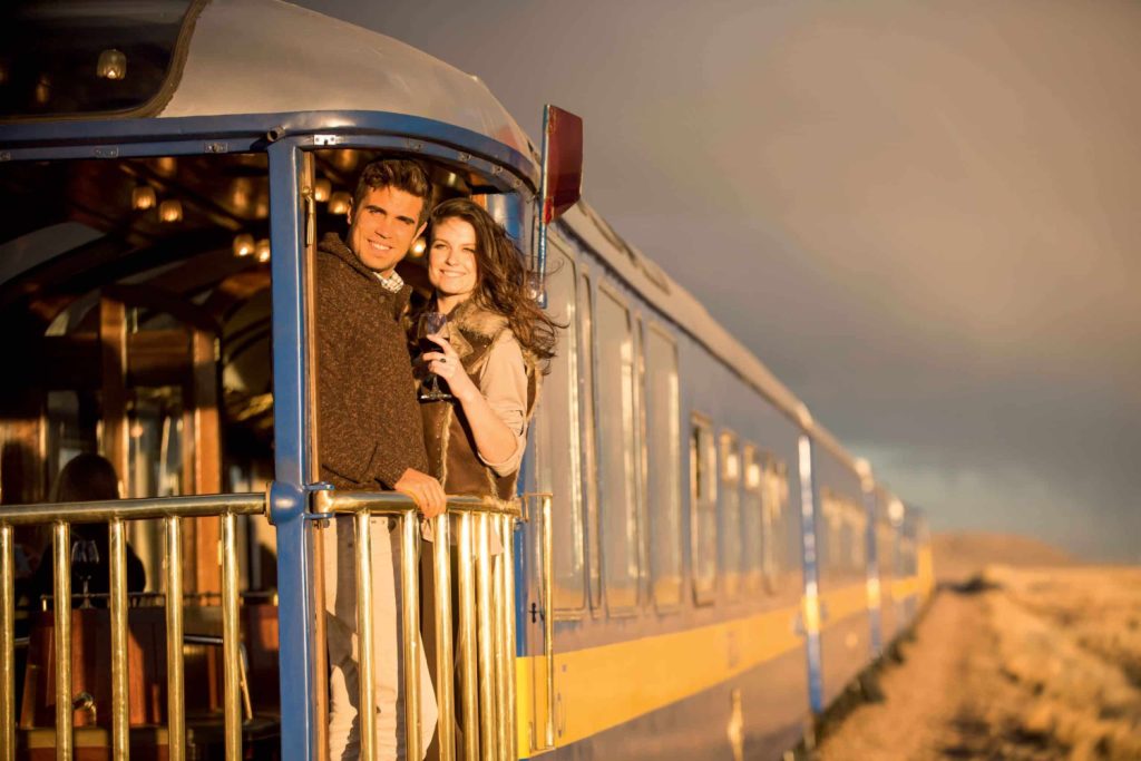 two people on a train in peru