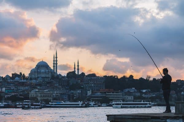 man fishing in istanbul