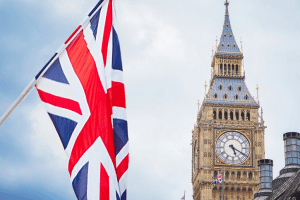 Union jack flag flying beside big ben in London, England