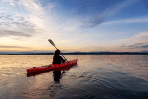 Kayaking at sunset in the Mediterranean sea in Spain