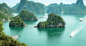 A beautiful lake in Vietnam with boats floating between the small islands