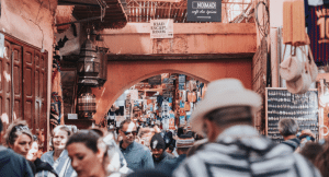 Popular medina in Marrakech with crowd passing through