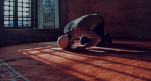 Muslim man praying in a mosque in Morocco