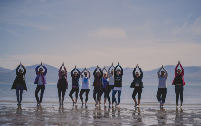 yoga group on the beach in Wales